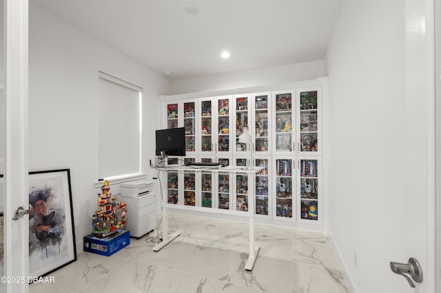 interior space featuring marble finish floor