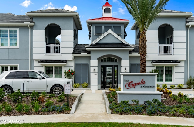 view of front of home with a balcony