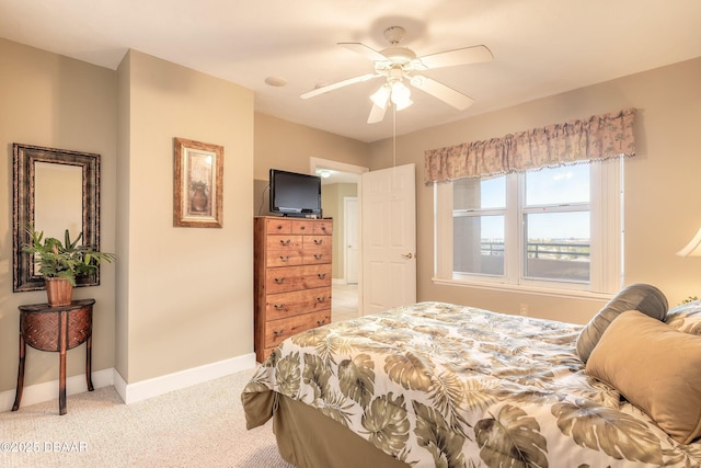 2055 S Atlantic Ave Unit 710, Daytona Beach, FL 32118 - bedroom with light colored carpet, baseboards, and a ceiling fan