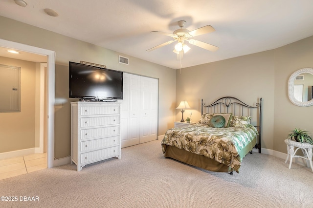 2055 S Atlantic Ave Unit 710, Daytona Beach, FL 32118 - bedroom with carpet floors, a closet, baseboards, electric panel, and ceiling fan