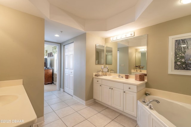2055 S Atlantic Ave Unit 710, Daytona Beach, FL 32118 - bathroom featuring vanity, tile patterned floors, a garden tub, recessed lighting, and baseboards