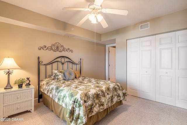 2055 S Atlantic Ave Unit 710, Daytona Beach, FL 32118 - bedroom with light carpet, a closet, and a ceiling fan