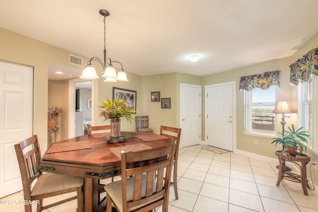 2055 S Atlantic Ave Unit 710, Daytona Beach, FL 32118 - dining space featuring light tile patterned floors and baseboards
