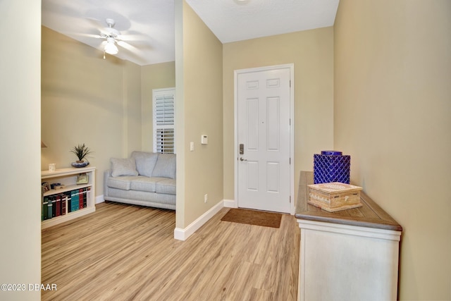 4670 Links Village Dr Unit B102, Ponce Inlet, FL 32127 - entrance foyer with wood finished floors, baseboards, and a ceiling fan