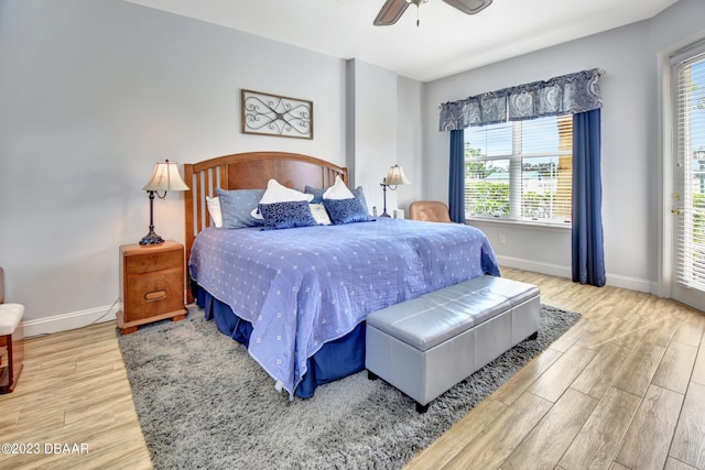 4670 Links Village Dr Unit B102, Ponce Inlet, FL 32127 - bedroom featuring wood finished floors, baseboards, and ceiling fan