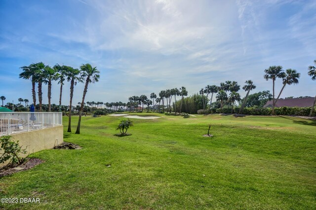 4670 Links Village Dr Unit B102, Ponce Inlet, FL 32127 - view of community with golf course view and a lawn