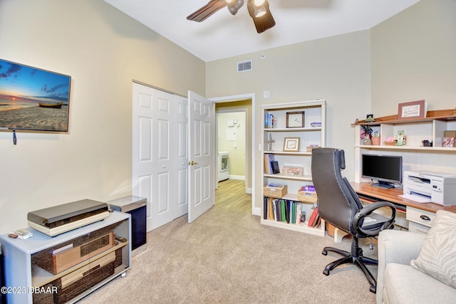 4670 Links Village Dr Unit B102, Ponce Inlet, FL 32127 - office area with a ceiling fan, light carpet, washer / dryer, and baseboards