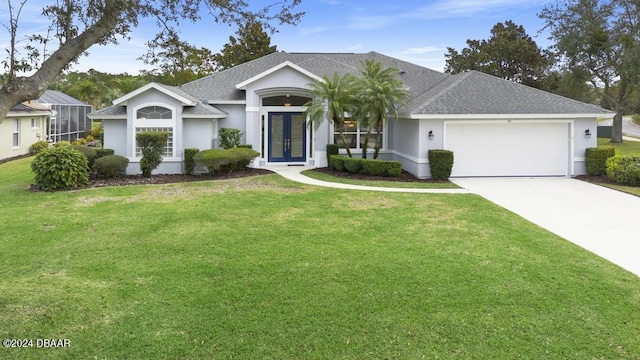 ranch-style house with french doors, a front yard, and a garage