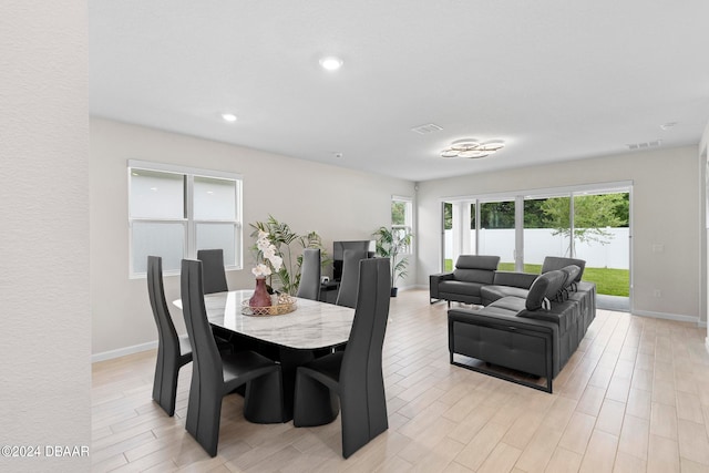 dining area with light wood-type flooring