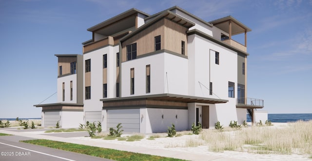 3403 S Atlantic Ave Unit 3, New Smyrna Beach, FL 32169 - view of building exterior featuring a water view and a garage