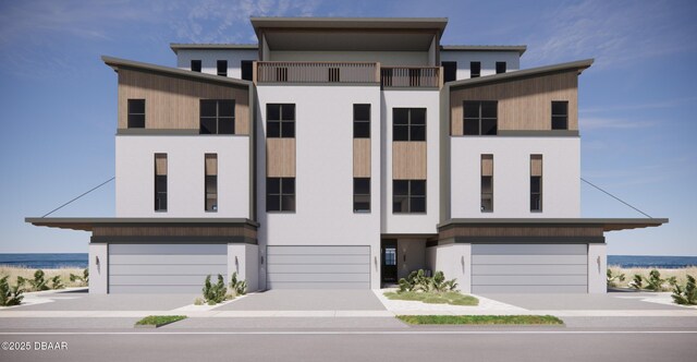 3403 S Atlantic Ave Unit 3, New Smyrna Beach, FL 32169 - view of front of house featuring stucco siding, an attached garage, and concrete driveway
