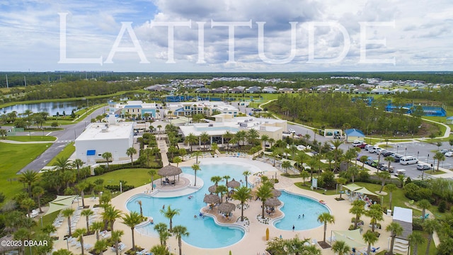 838 Attitude Ave, Daytona Beach, FL 32124 - drone / aerial view of a pool area and a large body of water