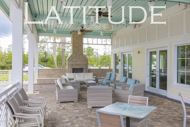838 Attitude Ave, Daytona Beach, FL 32124 - view of patio featuring an outdoor living space with a fireplace, french doors, and ceiling fan