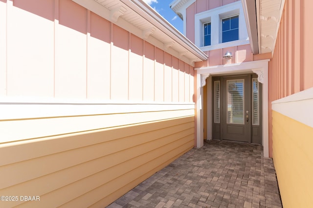 838 Attitude Ave, Daytona Beach, FL 32124 - doorway to property with board and batten siding