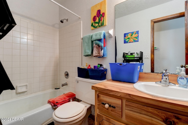 full bathroom featuring vanity, toilet, and tiled shower / bath