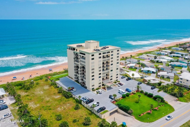 drone / aerial view with a view of the beach and a water view