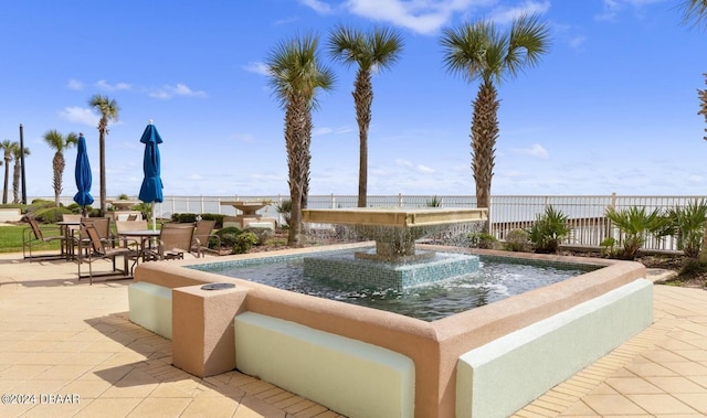 view of swimming pool featuring a patio area