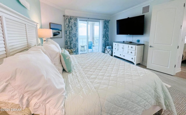 bedroom with access to outside, light hardwood / wood-style floors, and crown molding