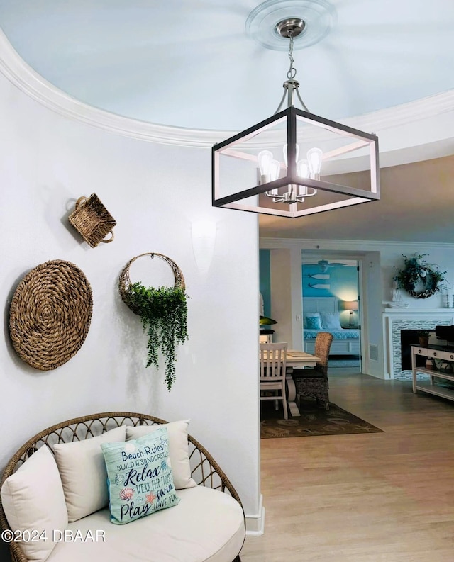 interior space with hardwood / wood-style floors, a notable chandelier, and crown molding