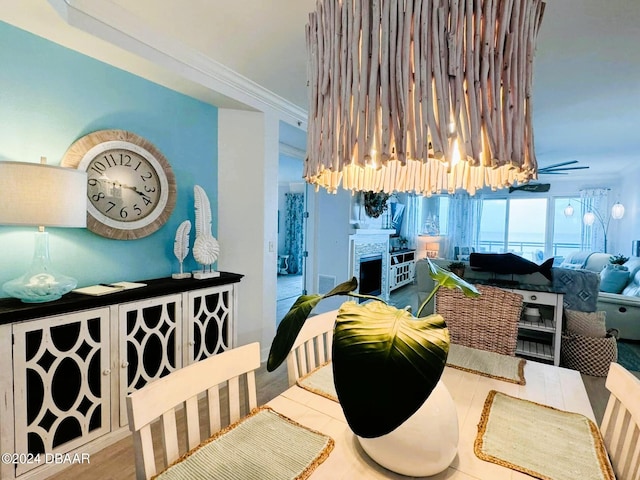 dining room featuring ornamental molding and wood-type flooring