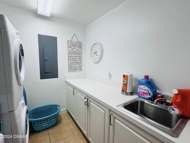 washroom with stacked washing maching and dryer, electric panel, light tile patterned flooring, cabinets, and sink