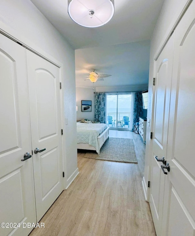 bedroom with ceiling fan and light wood-type flooring