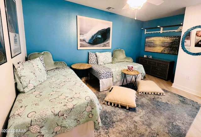 bedroom with hardwood / wood-style flooring and ceiling fan