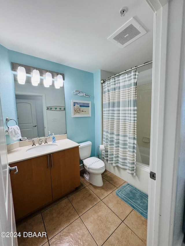 full bathroom featuring vanity, tile patterned floors, toilet, and shower / bath combination with curtain