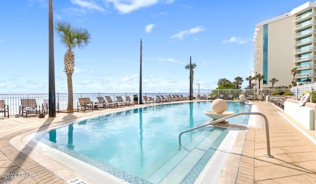 view of swimming pool with a patio area