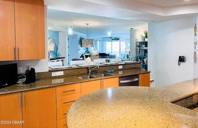 kitchen with sink, stainless steel dishwasher, ceiling fan, decorative light fixtures, and dark stone countertops