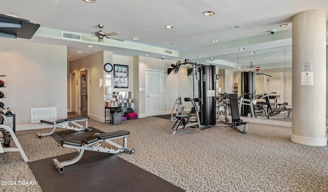 workout area with ceiling fan and carpet floors