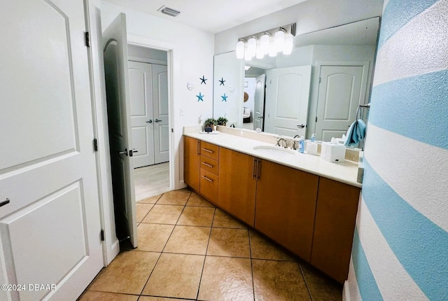 bathroom featuring vanity and tile patterned flooring