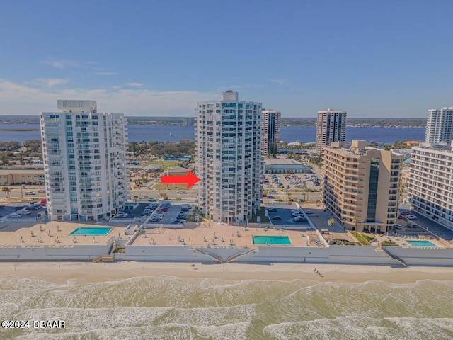 bird's eye view featuring a beach view and a water view