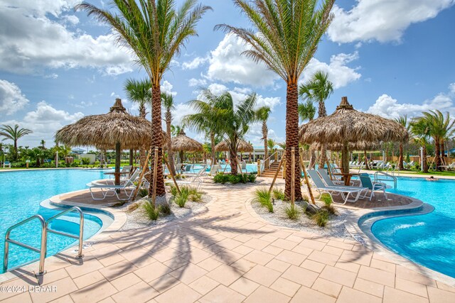 view of pool with a patio and a gazebo