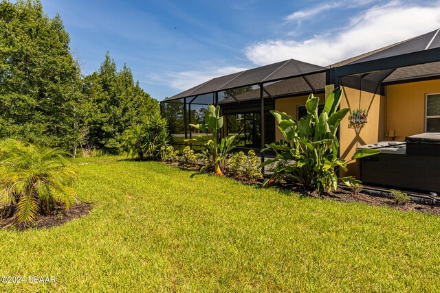 view of yard featuring glass enclosure