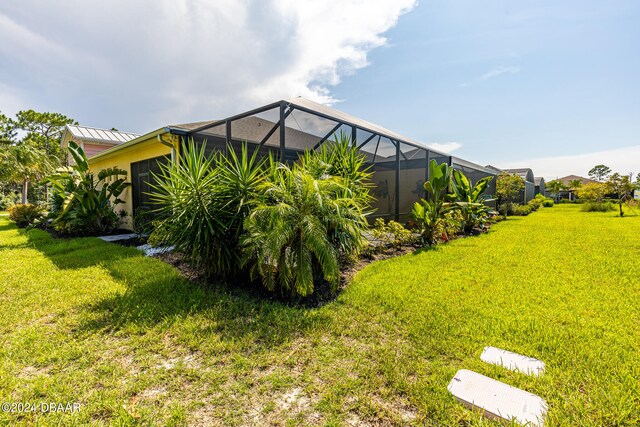 view of yard with a lanai