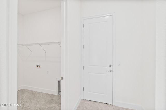 laundry area with hookup for a washing machine, laundry area, and baseboards