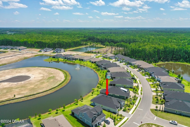 aerial view featuring a water view, a residential view, and a view of trees