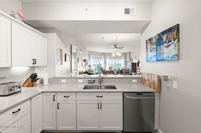 kitchen with stainless steel dishwasher, white cabinets, a sink, visible vents, and a ceiling fan