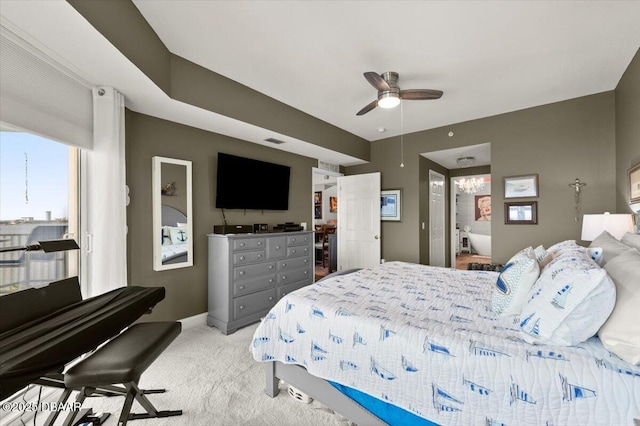 bedroom featuring multiple windows, visible vents, a ceiling fan, and light carpet