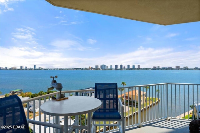 balcony featuring a view of city and a water view