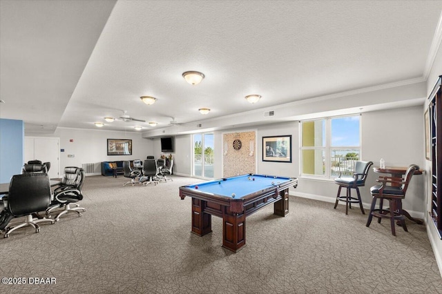 playroom featuring billiards, carpet, baseboards, ornamental molding, and a textured ceiling
