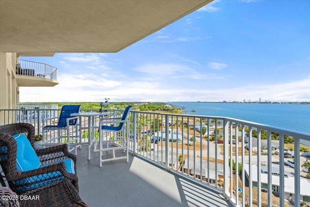 balcony featuring a water view