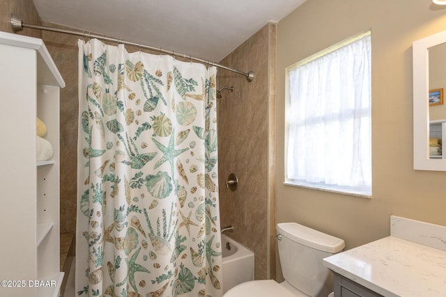 full bathroom with vanity, shower / tub combo, and toilet