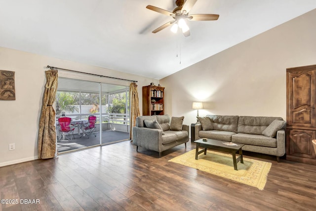 living room featuring dark hardwood / wood-style flooring, vaulted ceiling, and ceiling fan