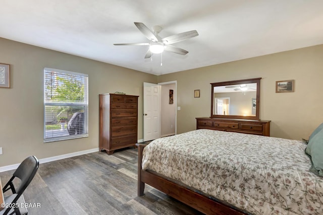 bedroom featuring ceiling fan and dark hardwood / wood-style flooring