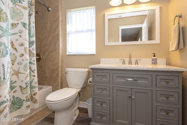 full bathroom with hardwood / wood-style flooring, vanity, shower / bath combo, and toilet