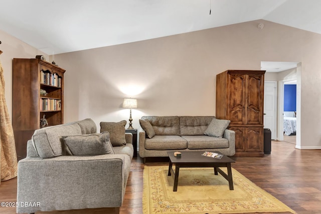 living room with dark hardwood / wood-style flooring and lofted ceiling