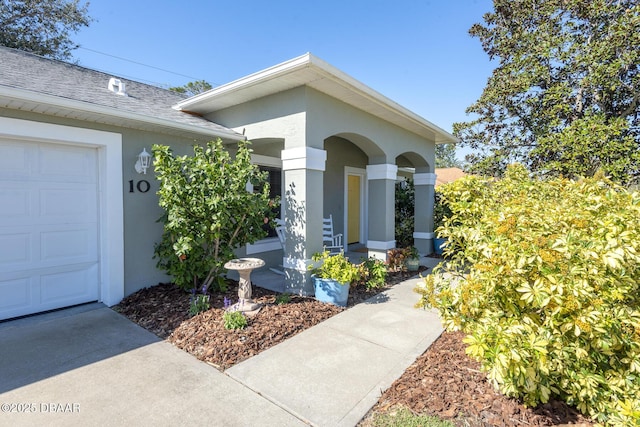 doorway to property featuring a garage