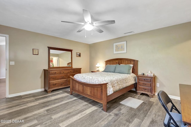 bedroom featuring ceiling fan and hardwood / wood-style flooring